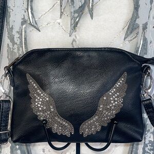 Cute faux leather bling wing crossbody bag.